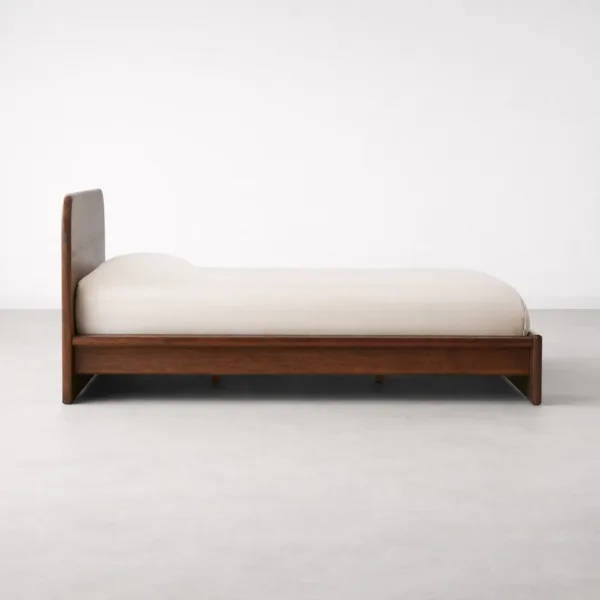 Side view of INTERIORZE Avelo teakwood low platform bed in walnut polish finish