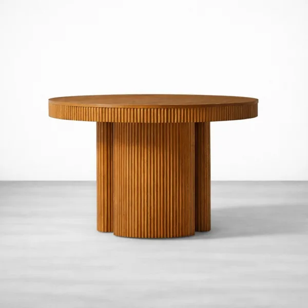 Round fluted teakwood dining table with textured base by INTERIORZE