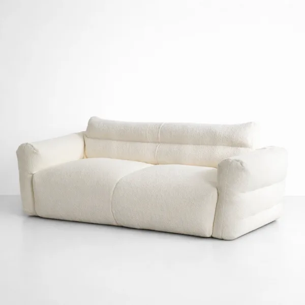 Angled front view of INTERIORZE Cloudline ivory boucle 2 seater sofa with deep cushioned seating and low profile