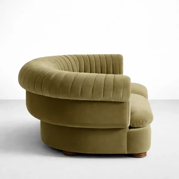 Side view of olive velvet 2 seater sofa with curved arms by INTERIORZE