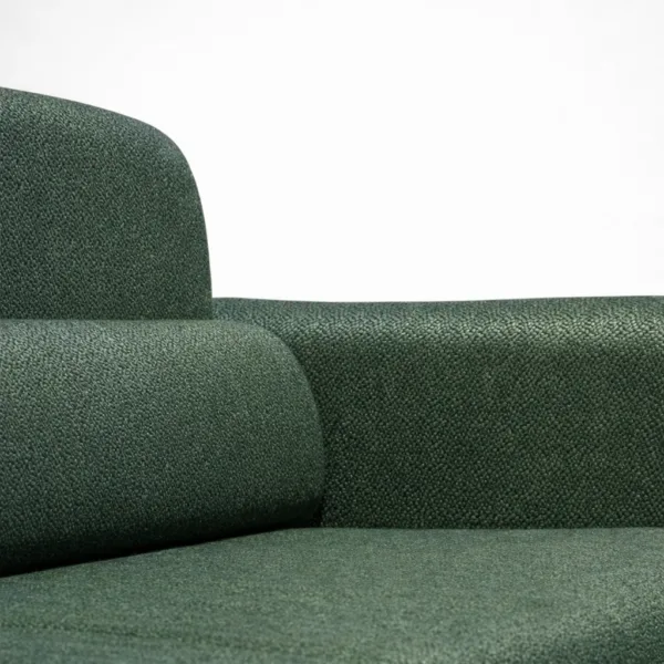 Forest green sofa fabric texture close-up with arm and back cushion detail