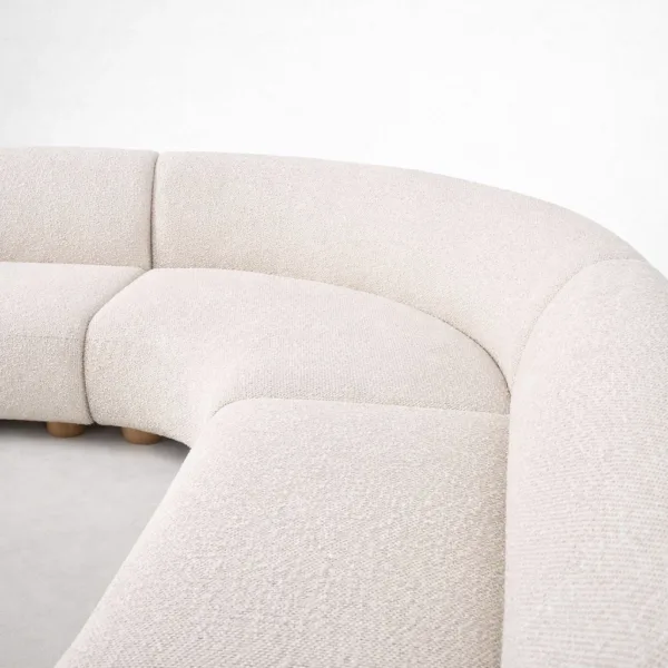 modern curved sectional sofa in neutral off-white bouclé for living room