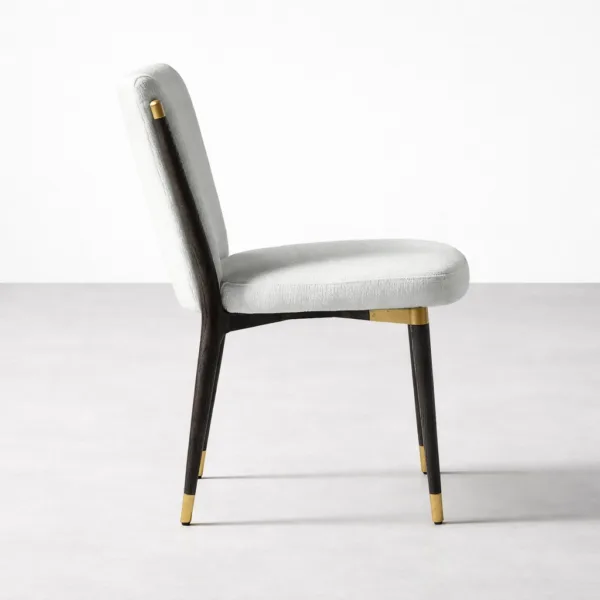 INTERIORZE Virello upholstered dining chair side profile with brass band