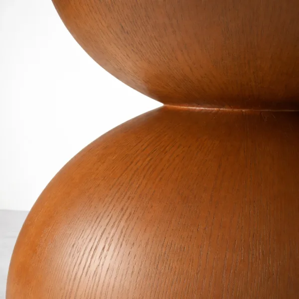 Teakwood pedestal base detail of Aurelia round marble top teakwood dining table