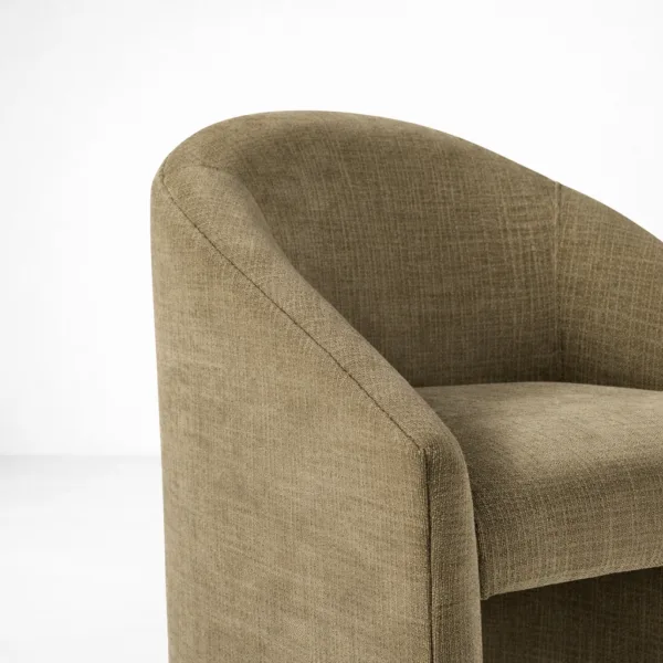Close-up of olive textured fabric upholstery on accent chair