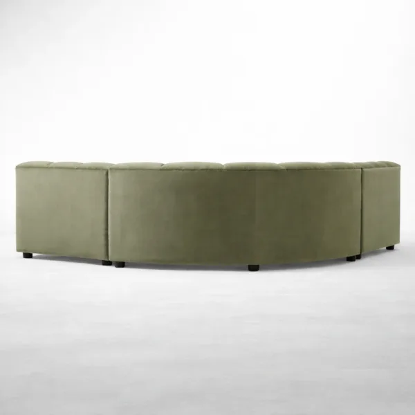Back view of olive green curved sectional sofa with upholstered base