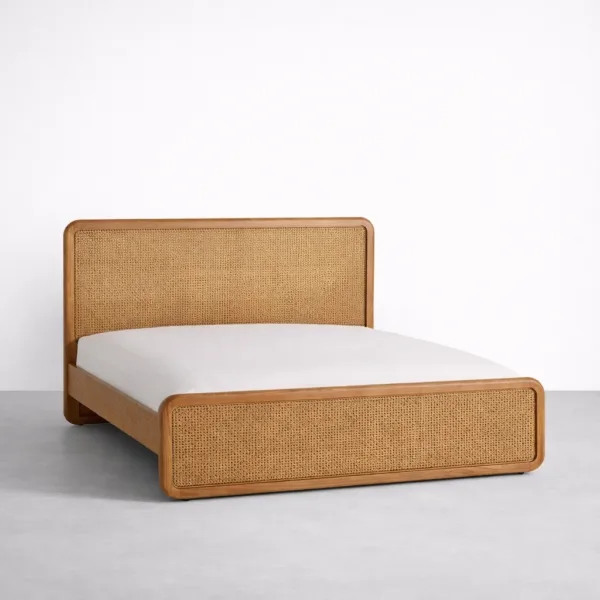 Teakwood cane bed with cane panel headboard and footboard angled view