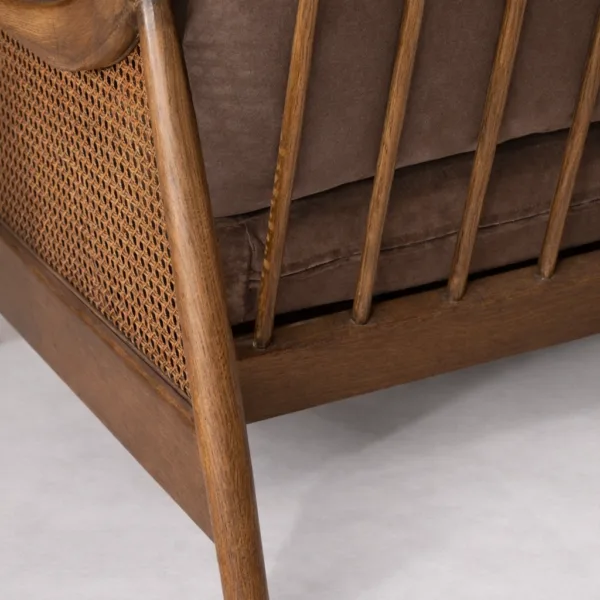 Close-up of handwoven cane panel and teakwood frame craftsmanship on 2 seater sofa