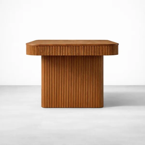 Side view of Rillan fluted teakwood dining table showing fluted legs