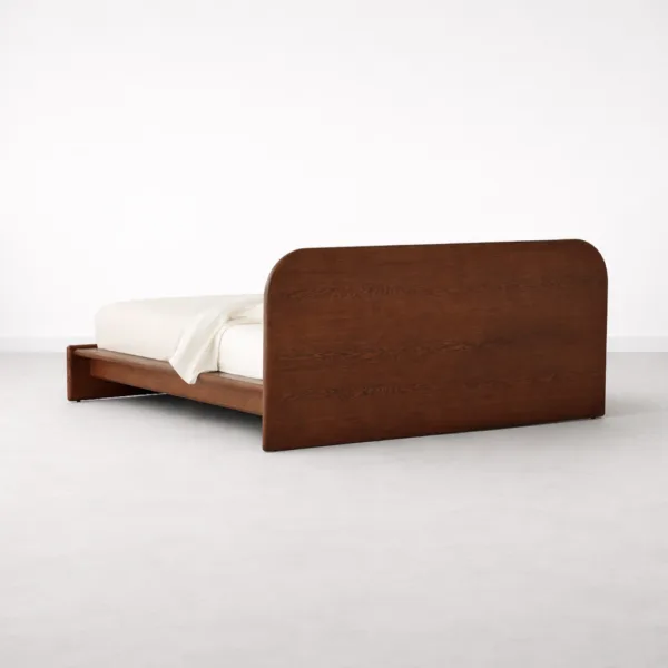 Rear angled view of INTERIORZE Avelo teakwood low platform bed in polished teakwood finish