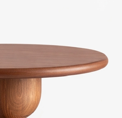 Handcrafted teakwood side table with round top and sculptural pedestal base by INTERIORZE