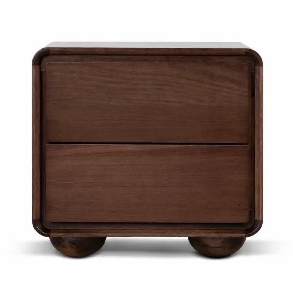 angled view of solid teakwood bedside table with curved edges