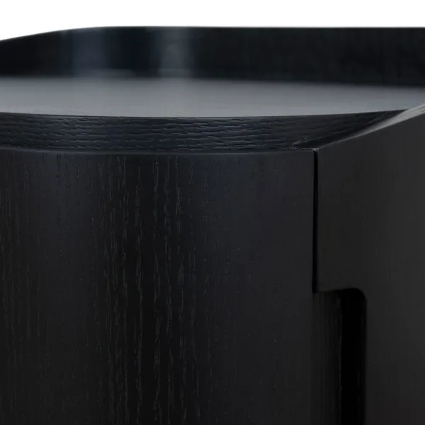 close up of tray top and curved edge detail on black teakwood bedside table