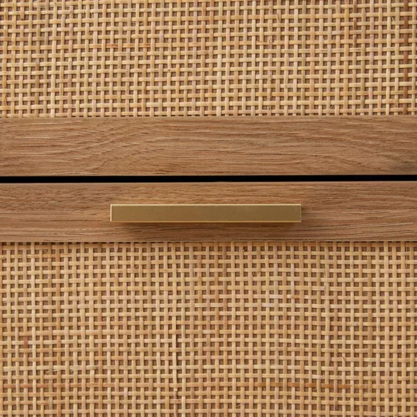 brass handle and cane weave detail on teak wood chest of drawers