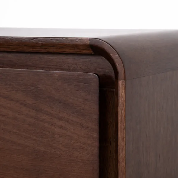 close up of curved corner detail on teakwood bedside table
