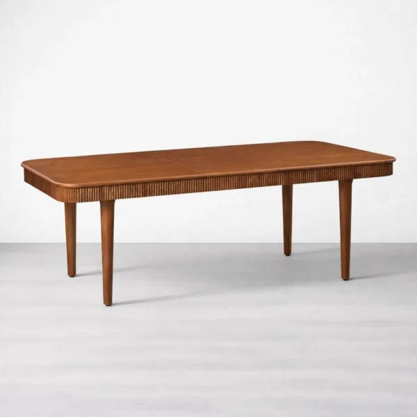 Angled view of INTERIORZE Elvora extended solid teakwood dining table solid teakwood extendable dining table