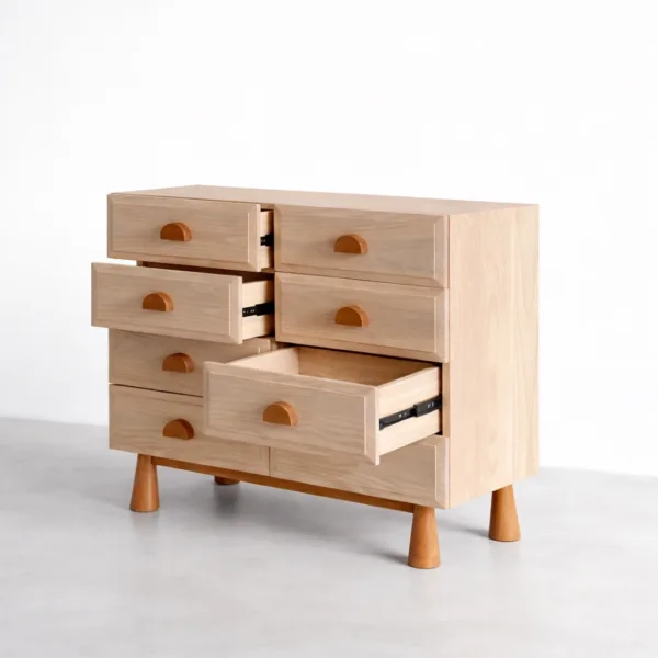 close up of handle and cane panel on ash wood chest of drawers