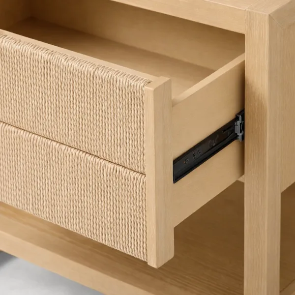 angled view of ashwood bedside table with open drawer