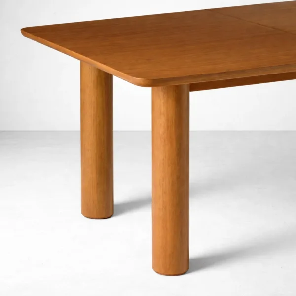 Close-up of cylindrical teakwood legs on INTERIORZE Tavero dining table