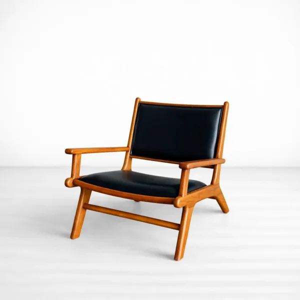 INTERIORZE Orion teakwood upholstered lounge arm chair with black seat and backrest in warm teak finish