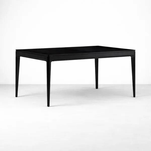 Angled view of INTERIORZE Kaelix black solid teakwood extendable dining table