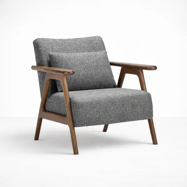 Angled view of grey upholstered teakwood lounge arm chair with walnut polish