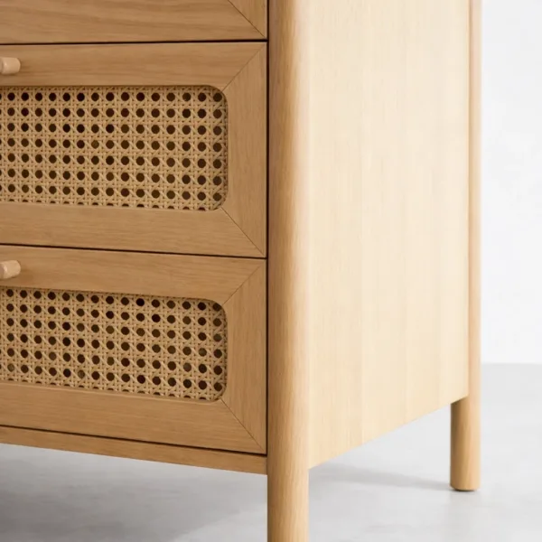 close up detail of woven cane drawer front in ash wood chest of drawers