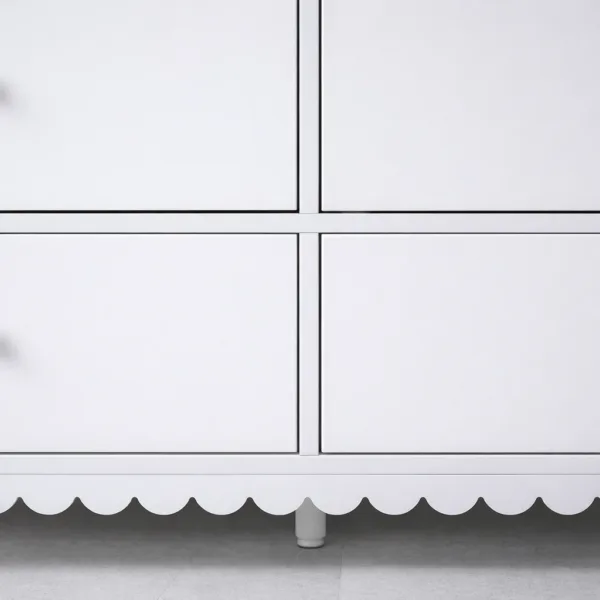 close-up of white chest of drawers with brass knobs by INTERIORZE