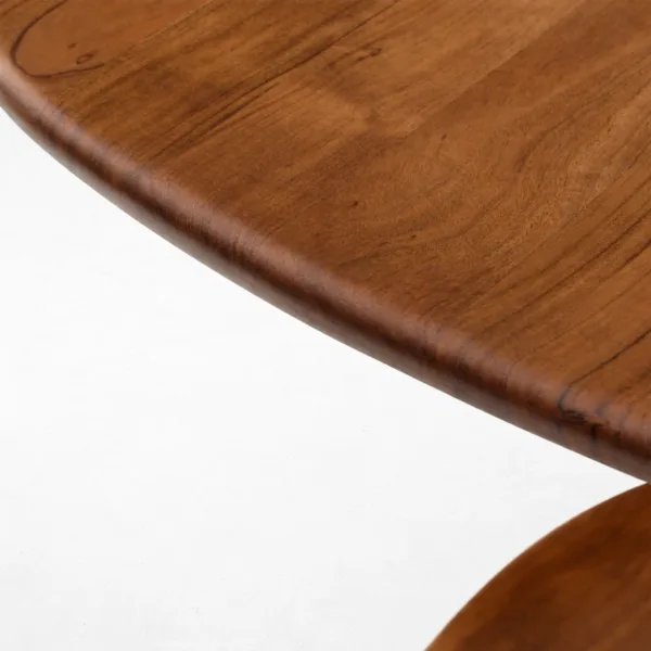 Close-up of rounded teakwood tabletop edge on INTERIORZE Rovena round dining table