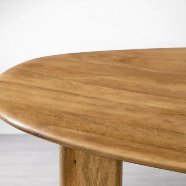 Close-up of solid teakwood oval tabletop with rounded edge on INTERIORZE Avelon dining table