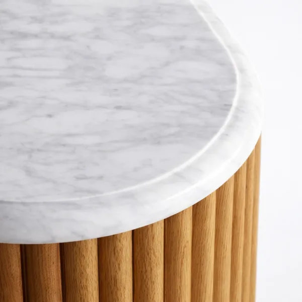close-up of white marble top on INTERIORZE fluted teak wood chest of drawers
