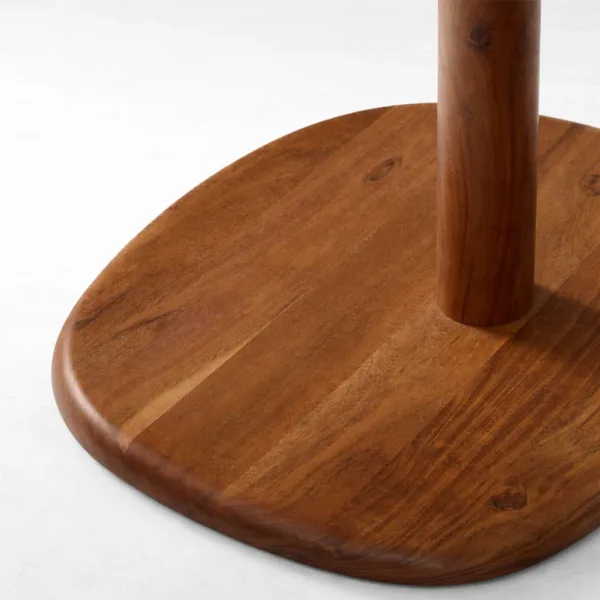 Close-up of circular teakwood base and pedestal on INTERIORZE Rovena dining table