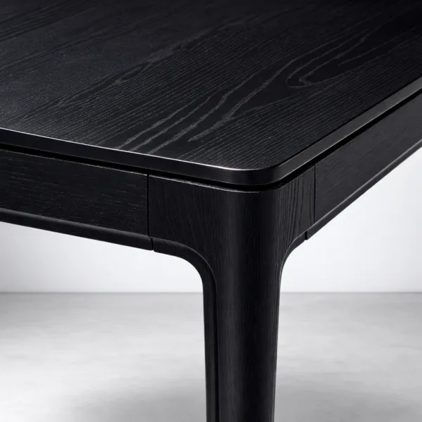 Close-up of rounded corner and black wood grain on INTERIORZE Kaelix dining table