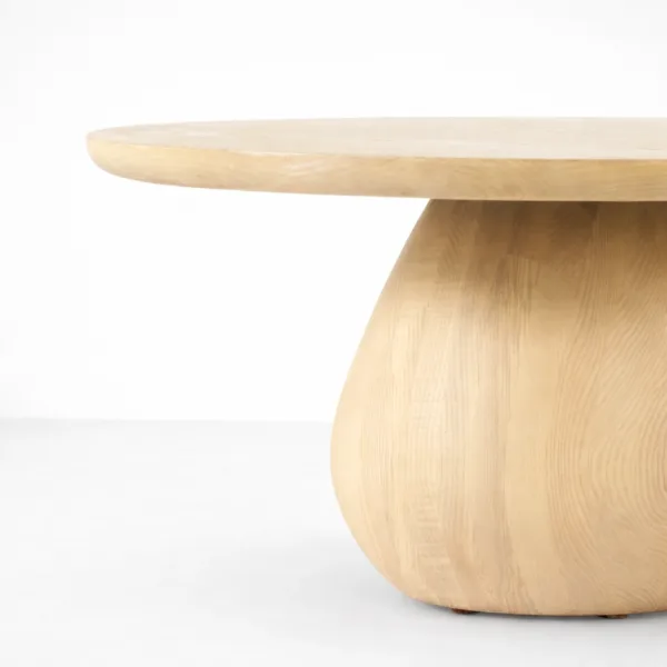 INTERIORZE ash wood coffee table with round top and sculptural pedestal base in natural finish