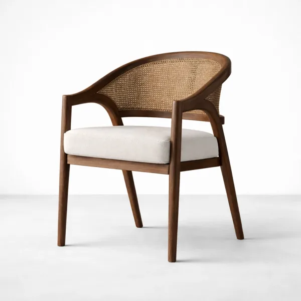 Angled view of teakwood cane back arm chair with off white fabric seat