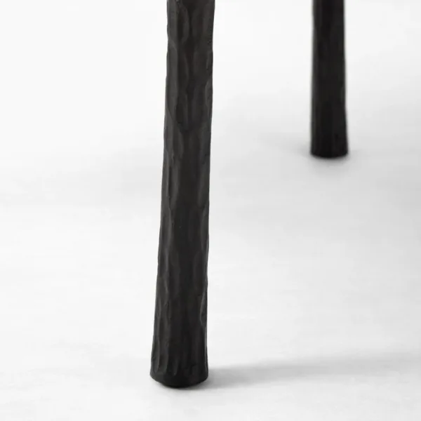 INTERIORZE teakwood round center table with slim sculptural legs in matte black finish