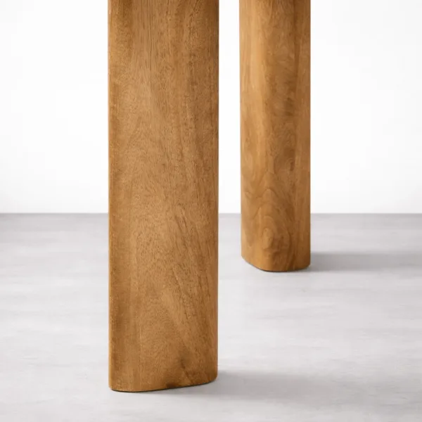 Close-up of cylindrical teakwood legs of INTERIORZE Avelon wooden dining table