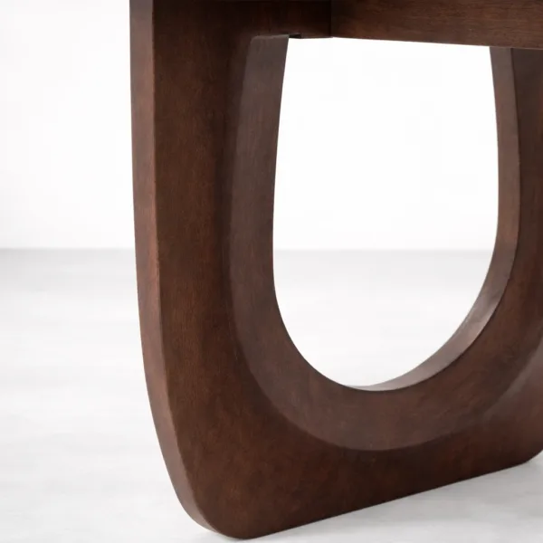 Close-up of sculptural loop base on INTERIORZE Arco Loop solid wood dining table