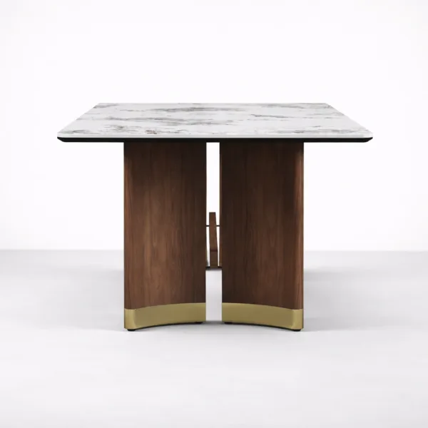 End view of INTERIORZE Aurelia marble top dining table with brass base accents