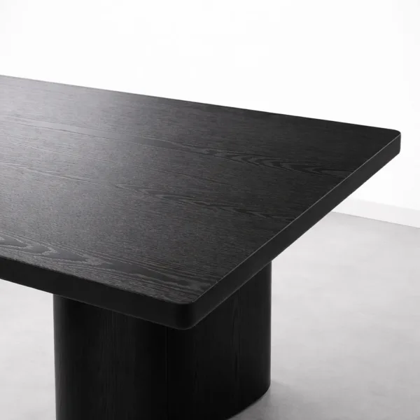 Close-up of tabletop corner on INTERIORZE Noir Axis solid wood dining table
