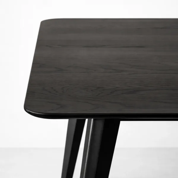 Close-up of tabletop corner and wood grain on INTERIORZE Vanta Edge dining table