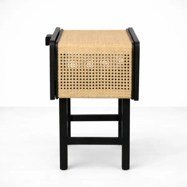 side view of teakwood cane bedside table with black frame