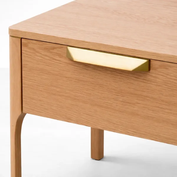 close up of brass handle on ashwood bedside table