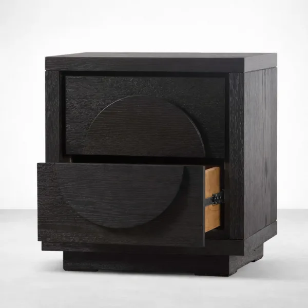 angled view of black teakwood bedside table with drawer open