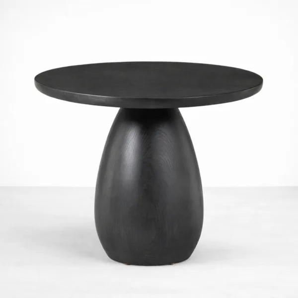 Pebble Pedestal teak wood side table by INTERIORZE with round top and sculptural pedestal base