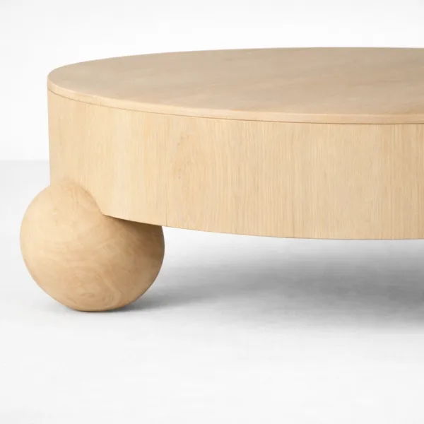 INTERIORZE ash wood coffee table with oval top and rounded orb legs in natural finish