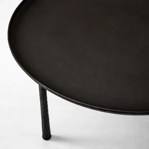 INTERIORZE teakwood round center table with slim sculptural legs in matte black finish