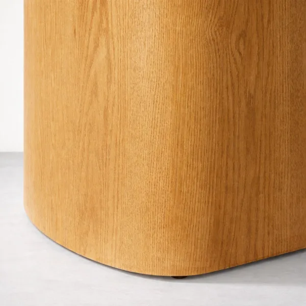 Close-up of curved teakwood pedestal base of INTERIORZE Arvello dining table