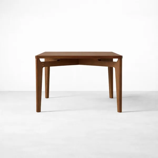 Angled view of INTERIORZE Cavero extendable teakwood dining table