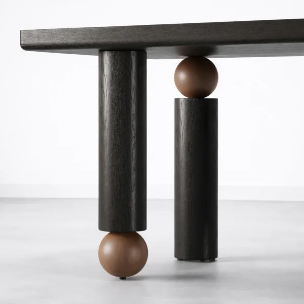 Side detail of INTERIORZE Noir Axis solid wood dining table with cylindrical supports